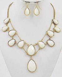 gold tone necklace with cream acrylic stones, and earrings