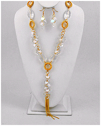 Long lucite and gold necklace with chain tassle