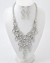 Silver tone graduating collar necklace with matching earrings